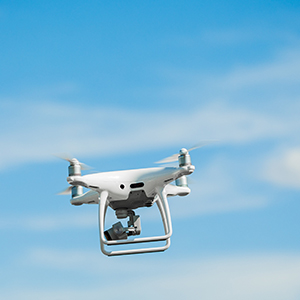 The latest version of a drone flying in clear blue skies.