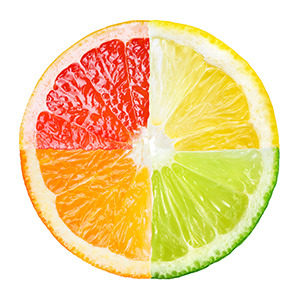 Citrus fruit cut in fourths and each section is a different bright color.